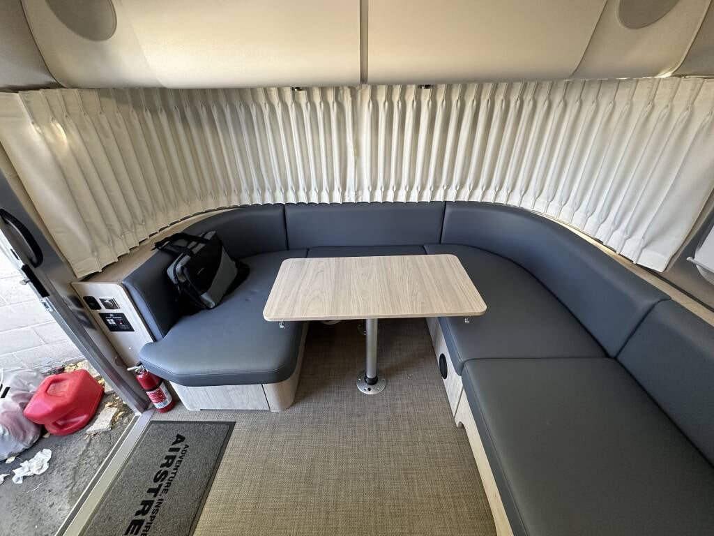 2021 Airstream Globetrotter 27FB Twin — L-shaped lounge dinette