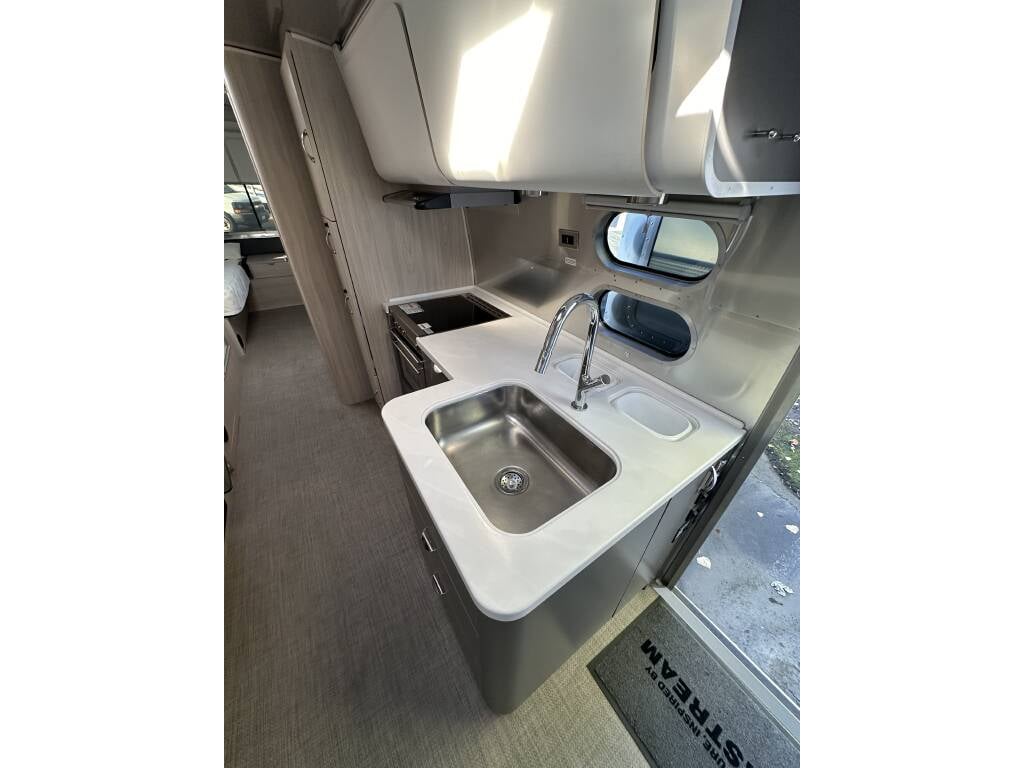 2021 Airstream Globetrotter 27FB Twin — kitchen with Corian countertops