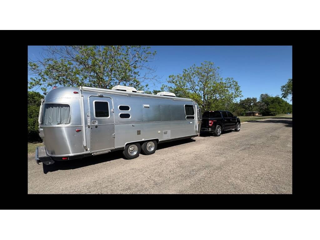 2019 Airstream Tommy Bahama Special Edition 27FB — hitched and ready to tow