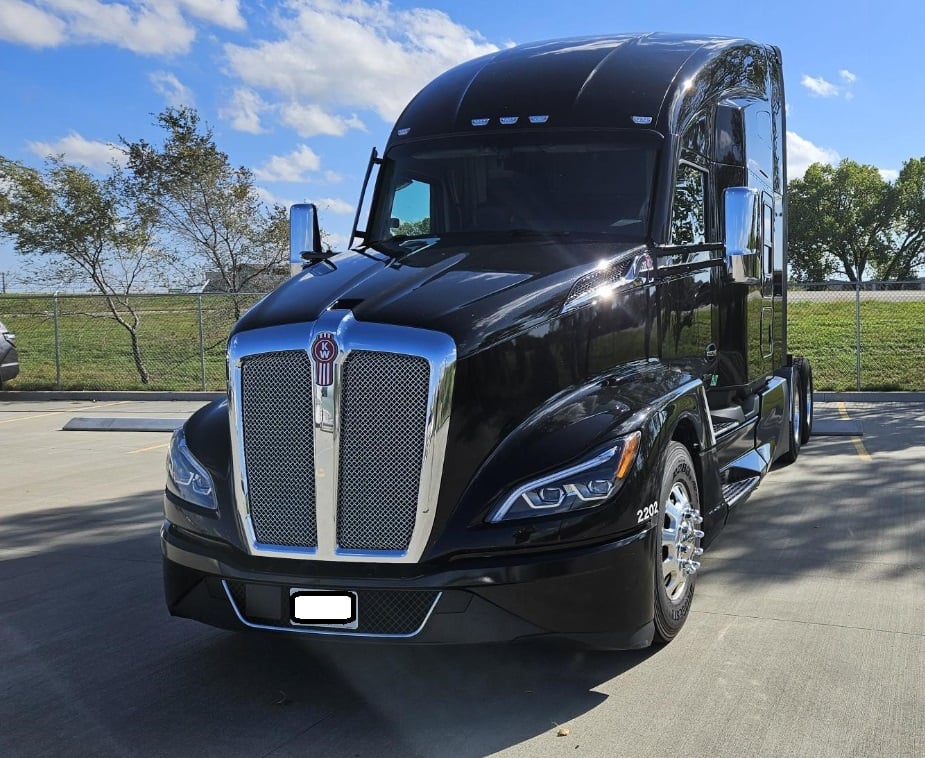 2022 Kenworth T680 sleeper semi truck in black — front three-quarter view