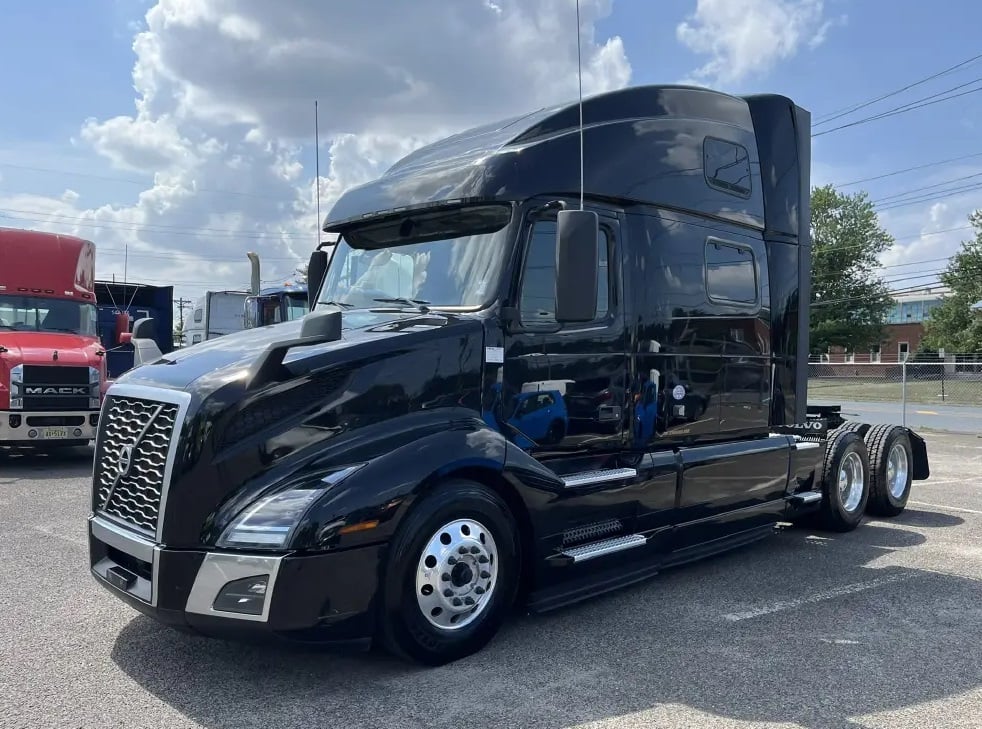 2024 Volvo VNL860 double bunk sleeper semi truck in black — front three-quarter view