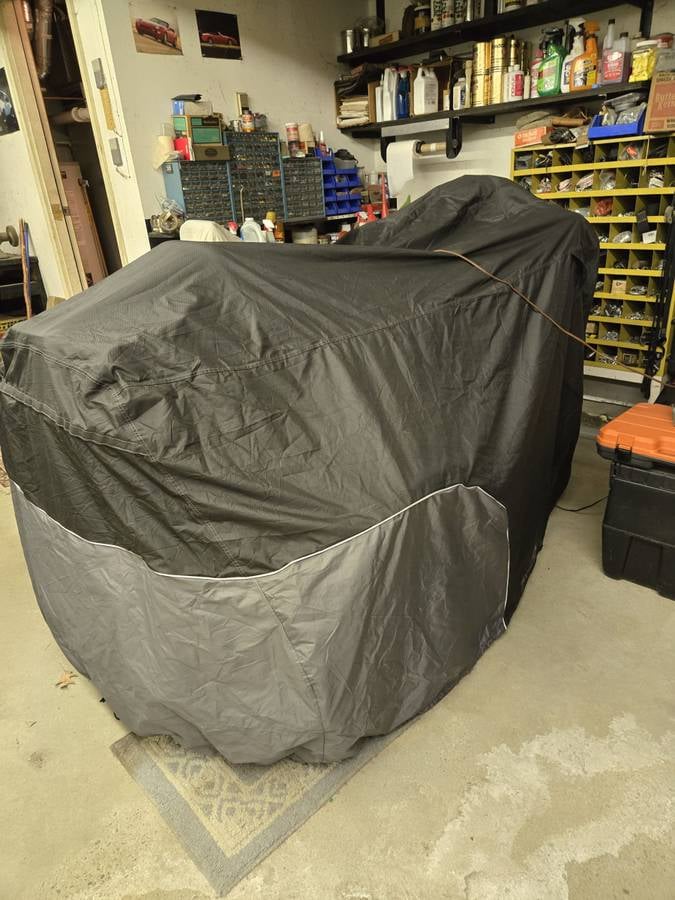2022 Harley-Davidson CVO Tri Glide under its storage cover in the garage