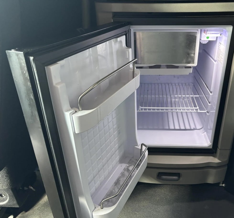 2024 Peterbilt 579 — sleeper mini fridge with door open