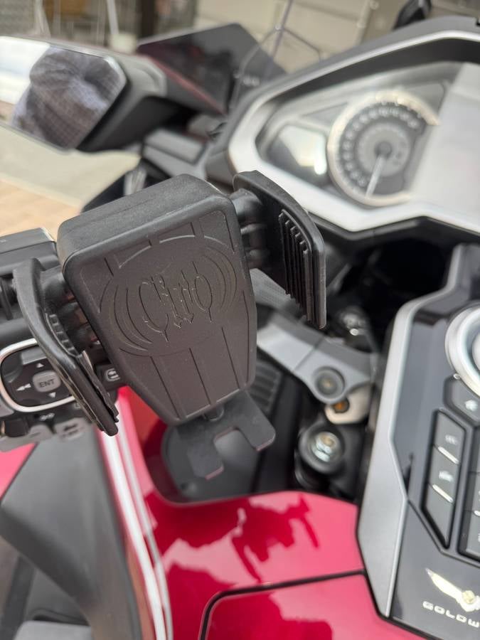 Phone cradle charger on the handlebar