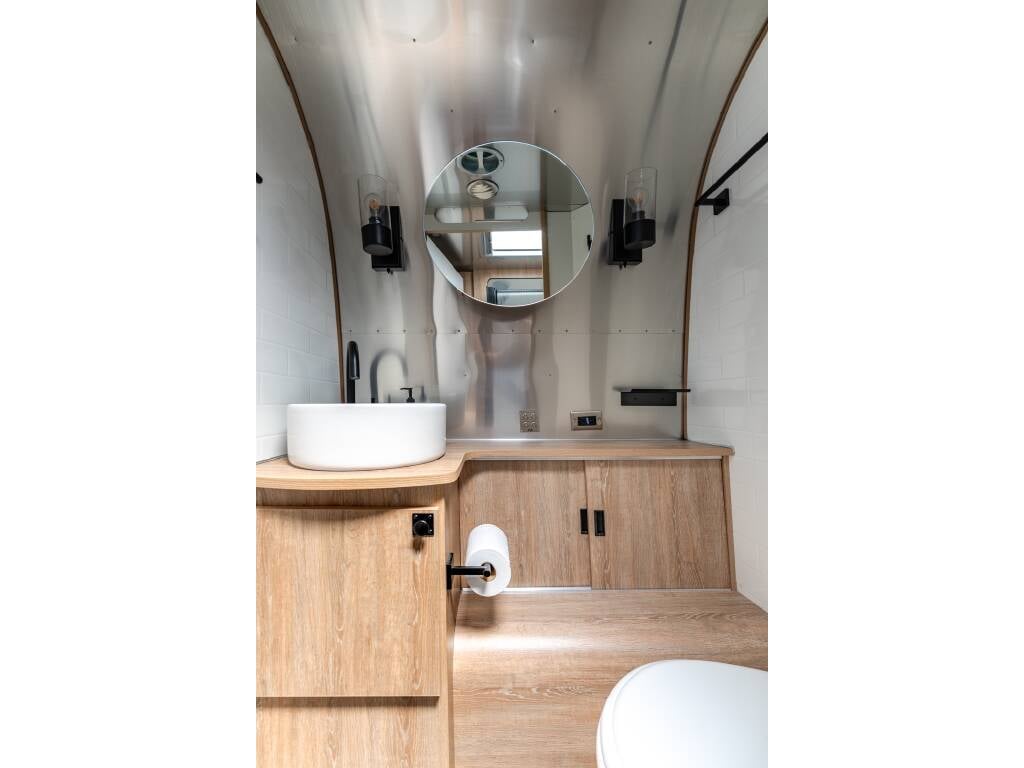 2022 Airstream Pottery Barn Special Edition 28RBQ — bathroom vanity and mirror