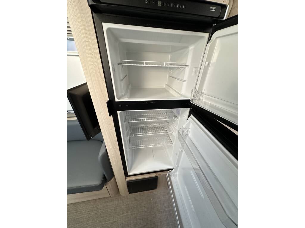 2021 Airstream Globetrotter 27FB Twin — refrigerator with door open