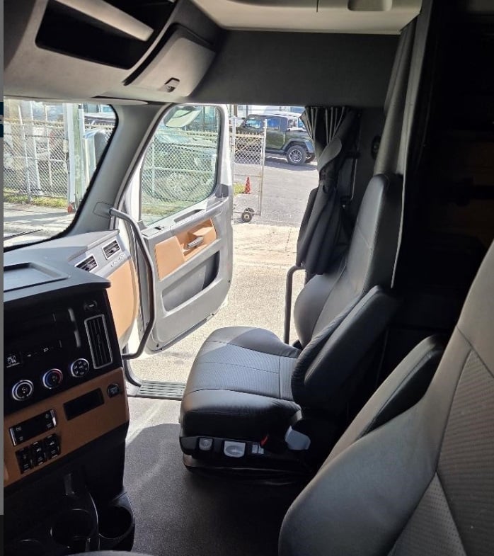 2024 Freightliner Cascadia 126 — driver seat and dash