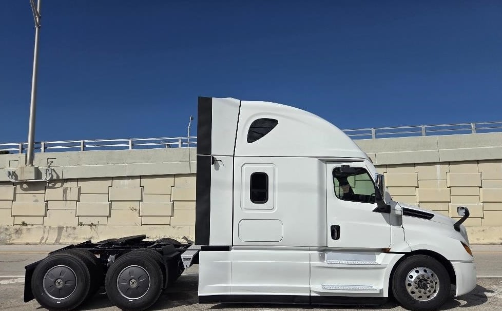 2024 Freightliner Cascadia 126 sleeper semi truck in white — front three-quarter view